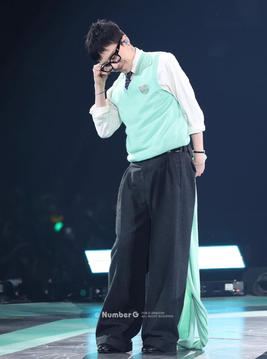 Chanel made the sweater and scarf in mint green for GD , his fav