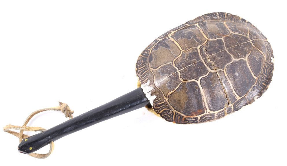 Crow Indian Turtle Shell Rattle w/ Carved Handle sold at auction