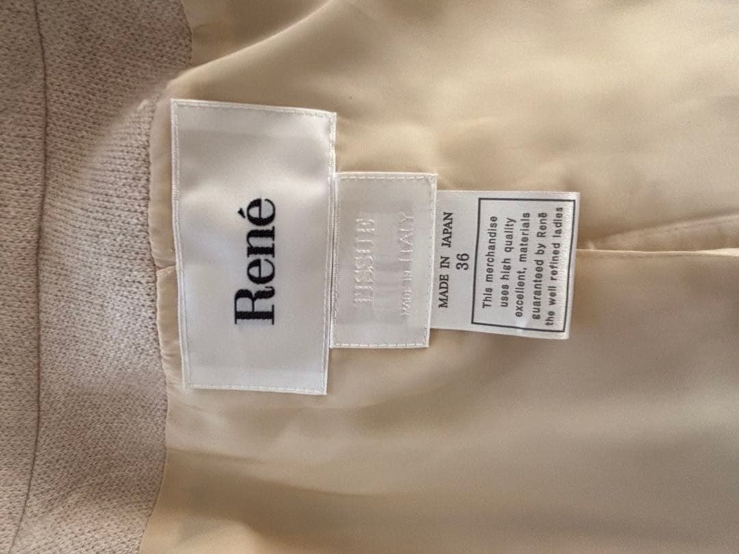 クリーム色 ロングコート ジップアップ　ファートリミング