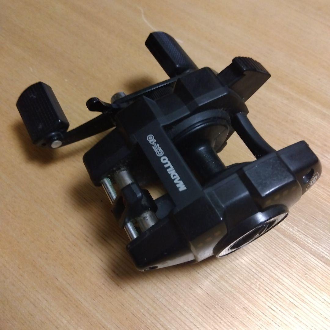 ㊼オリムピック　マジロCX-10ブラック ベイトリール