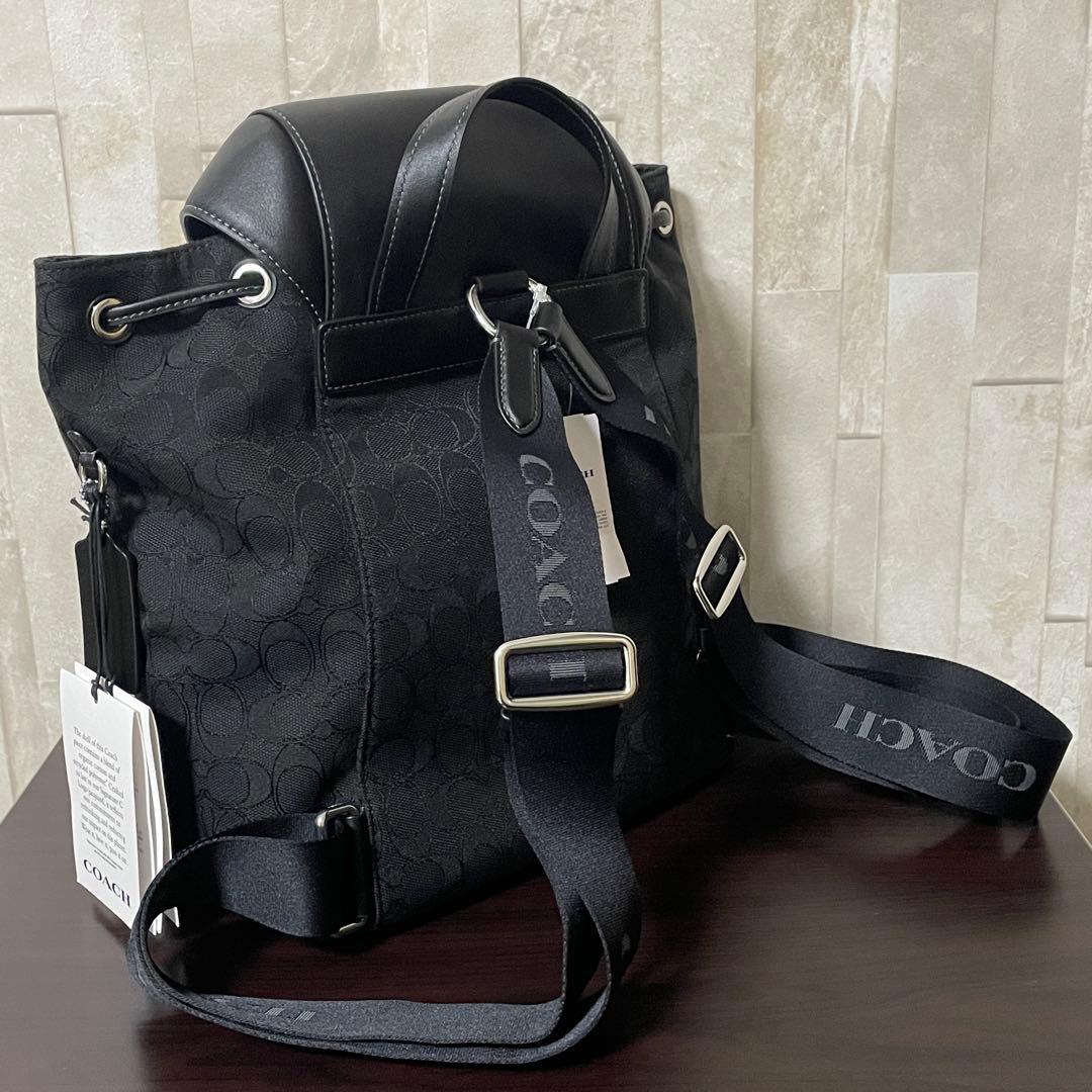 早い者勝ち！訳あり新品 COACH バックパック シグネチャー柄 ブラック