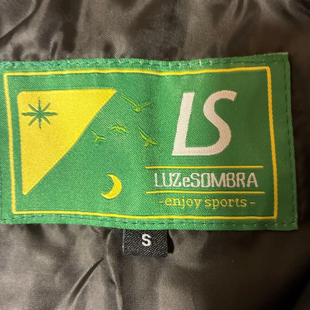 LUZeSOMBRA ピステ・ウィンドブレーカー Sサイズ ブラック・チャコール
