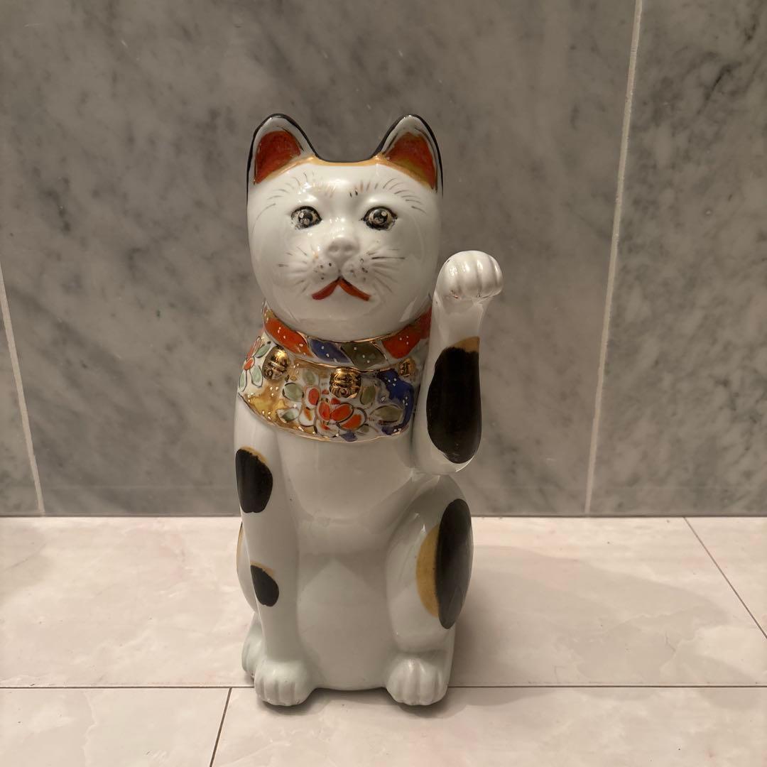 アンティーク神秘的な瞳でとても雰囲気のあるお金や良き人を招く招き