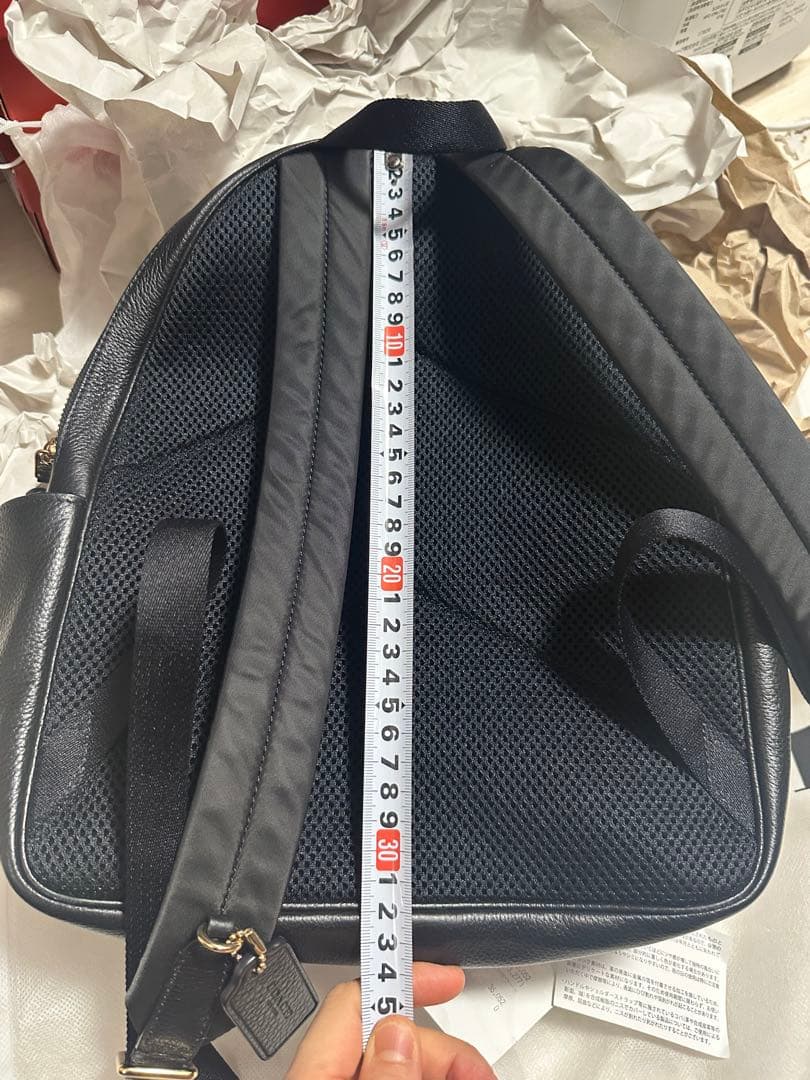 バッグ COACH PEBBLED LEATHER COURT BACKPACK