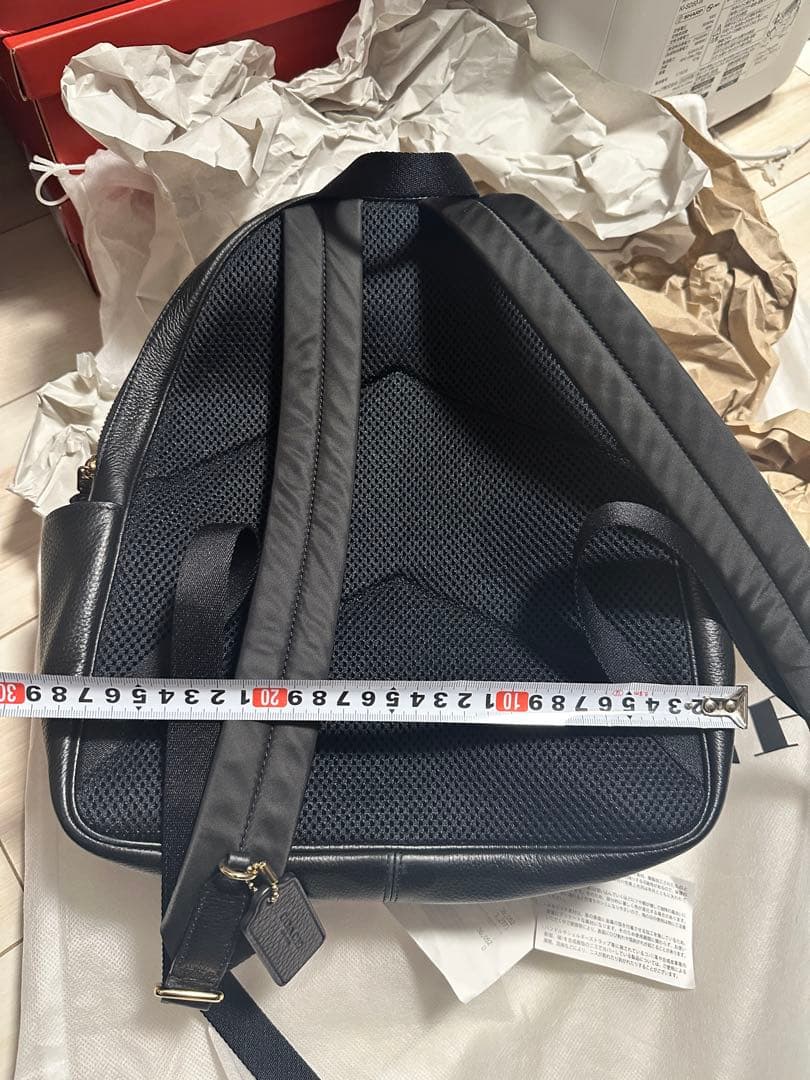 バッグ COACH PEBBLED LEATHER COURT BACKPACK