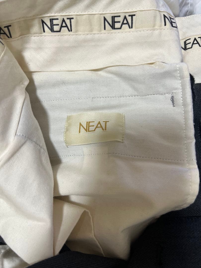 NEAT ワイドテーパード スラックス