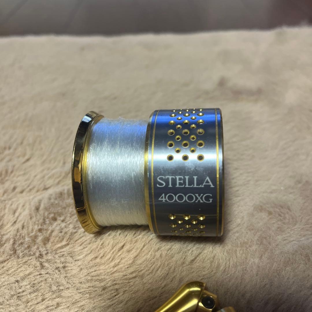 ステラ4000xgスプールと シマノ4000番クラスのハンドル２個、キャップ