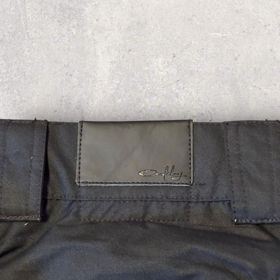 【オークリー】スキー　スノボーパンツ　M 黒　刺繍ロゴ　11年製　希少品　k